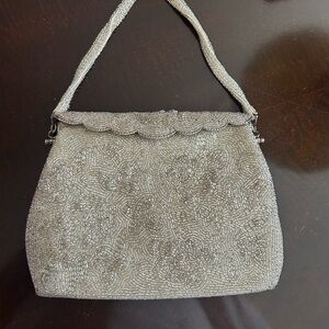 Vintage silver beaded purse from the 1960’s. Metal flap, beaded handle.